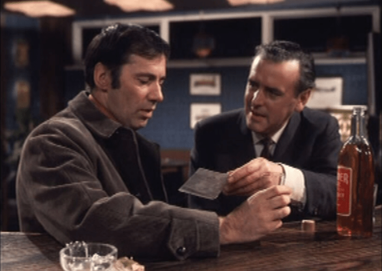 Two men sitting at a bar